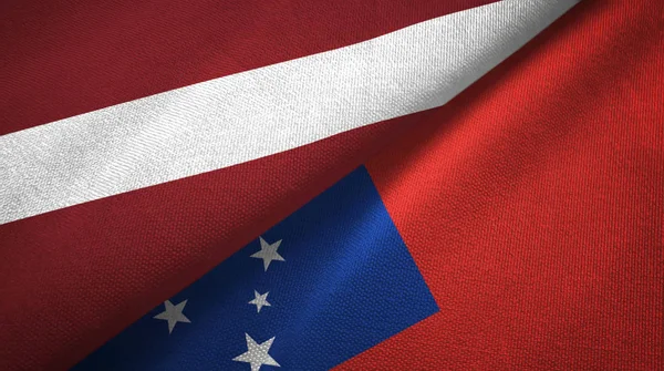 Lettonia e Samoa due bandiere tessuto, tessitura tessuto — Foto Stock