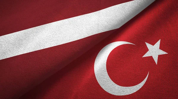 Latvia dan Turki dua bendera kain tekstil, tekstur kain — Stok Foto