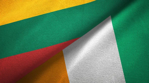 Litauen och Cote Divoire Ivory Coast två flaggor textil tyg textur — Stockfoto