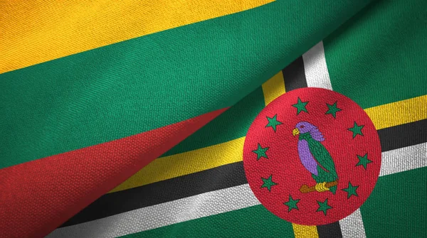 Lituania e Dominica due bandiere tessuto, tessitura tessuto — Foto Stock
