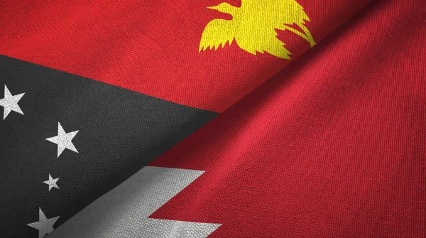 巴布亚新几内亚和巴林两旗纺织布，织物质地 — 图库照片