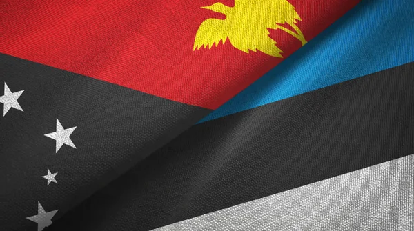 Papúa Nueva Guinea y Estonia dos banderas tela textil, textura de la tela — Foto de Stock
