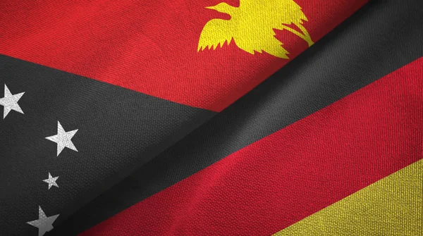 Papúa Nueva Guinea y Alemania dos banderas tela textil, textura de la tela — Foto de Stock