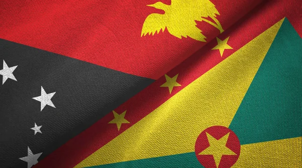 Papua Nuova Guinea e Grenada due bandiere tessuto, tessitura tessuto — Foto Stock