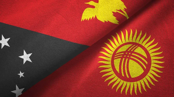 Papúa Nueva Guinea y Kirguistán dos banderas tela textil, textura de la tela — Foto de Stock