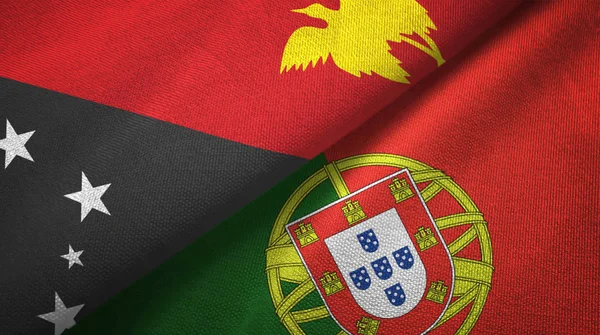 Papua Nuova Guinea e Portogallo due bandiere tessuto, tessitura tessuto — Foto Stock