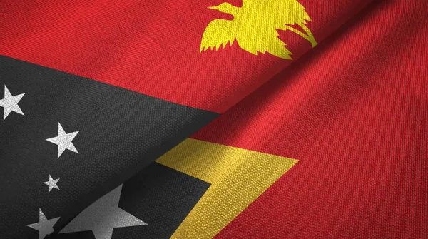 Papúa Nueva Guinea y Timor Oriental Timor Oriental dos banderas de tela textil — Foto de Stock