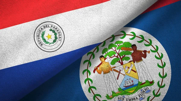 Paraguay y Belice dos banderas de tela textil, textura de tela — Foto de Stock