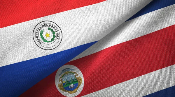 Paraguay och Costa Rica två flaggor textil tyg, tyg konsistens — Stockfoto