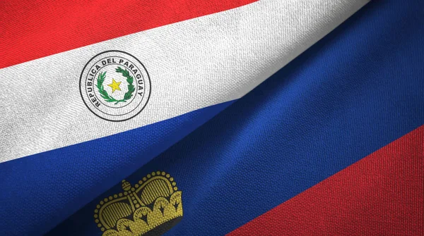 Парагвай и Лихтенштейн два флага текстильная ткань, текстура ткани — стоковое фото