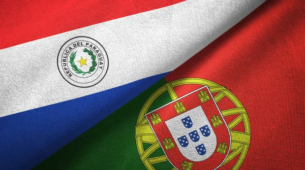 Paraguay och Portugal två flaggor textil trasa, tyg textur — Stockfoto