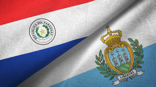 Paraguay e San Marino due bandiere tessuto, tessitura tessuto — Foto Stock