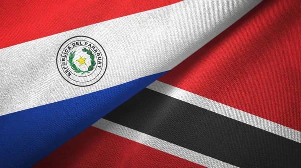 Парагвай и Тринидад и Тобаго два флага текстильная ткань, текстура ткани — стоковое фото
