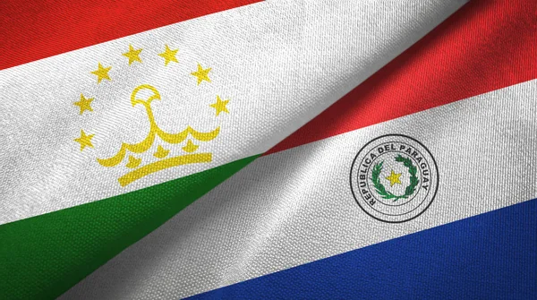 Tajikistan and Paraguay two flags textile cloth, fabric texture — Stock Photo, Image