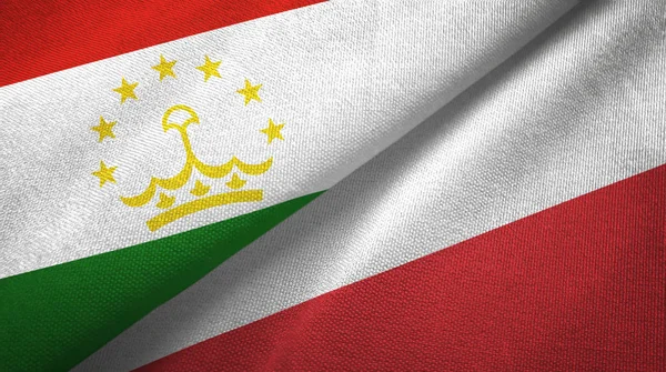Таджикистан и Польша два флага текстильная ткань, текстура ткани — стоковое фото