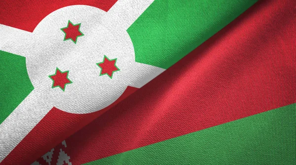 Burundi och Vitryssland två flaggor textil tyg, tyg konsistens — Stockfoto