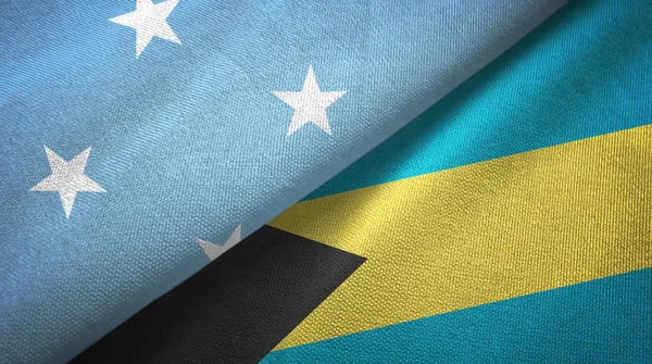 Mikronézia és a Bahamák két zászló textil ruhával, szövet textúra — Stock Fotó