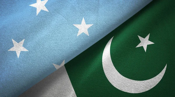 Mikronésie a Pákistán dvě vlajky textilní tkaniny, textura textilií — Stock fotografie
