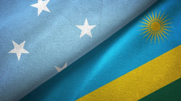 Micronesia en Rwanda twee vlaggen textiel doek, weefsel textuur — Stockfoto