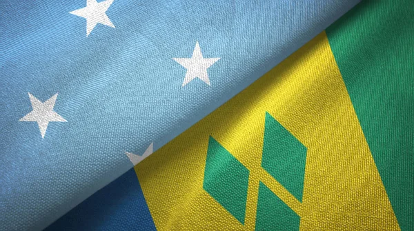 Micronesia and Saint Vincent and the Grenadines two flags textile cloth — Stock Photo, Image