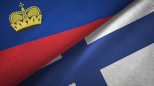 Liechtenstein és Finnország két zászló textil ruhával, szövet textúra — Stock Fotó