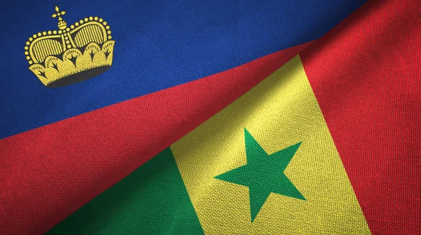 Liechtenstein en Senegal twee vlaggen textiel doek, stof textuur — Stockfoto