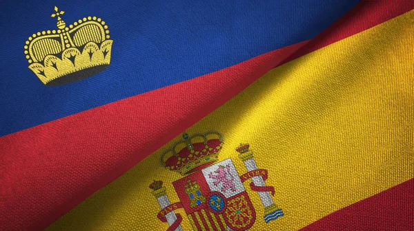 Лихтенштейн и Испания два флага текстильная ткань, текстура ткани — стоковое фото