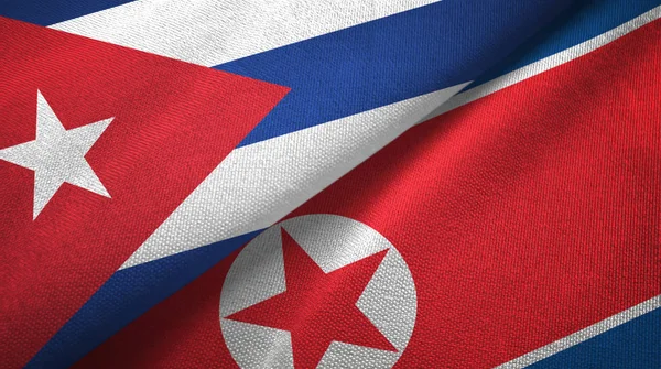 Cuba and North Korea two flags textile cloth, fabric texture — Stock Photo, Image