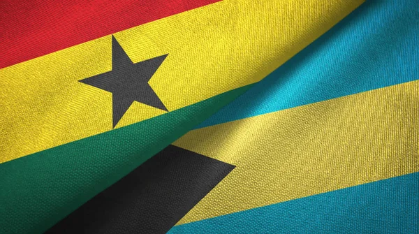 Ghana och Bahamas två flaggor textil trasa, tyg konsistens — Stockfoto