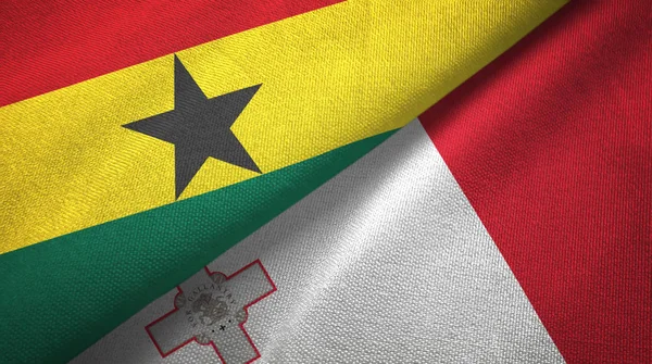 Ghana och Malta två flaggor textil trasa, tyg textur — Stockfoto