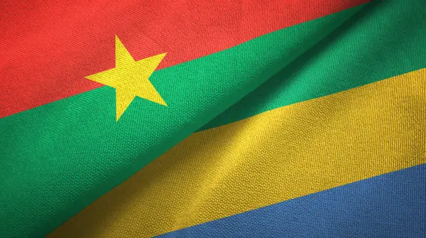 Burkina Faso en Gabon twee vlaggen textiel doek, weefsel textuur — Stockfoto