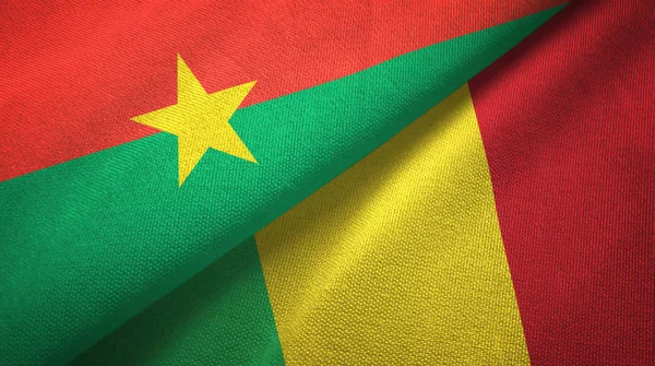 Burkina Faso és Mali két zászló textil ruhával, szövet textúra — Stock Fotó