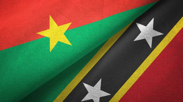 Burkina Faso and Saint Kitts and Nevis two flags textile cloth, fabric texture — Stock Photo, Image