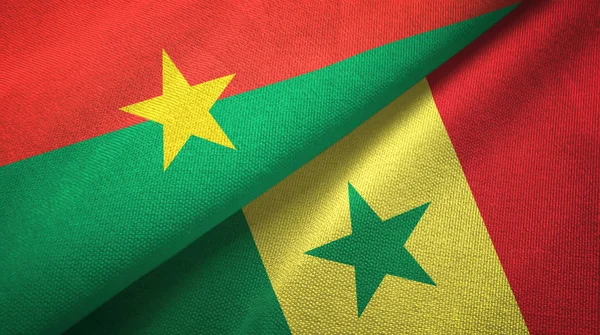 Burkina faso und senegal zwei flaggen textilstoff, textur — Stockfoto