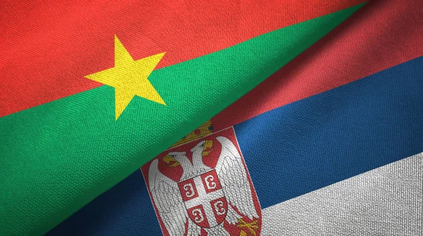 Burkina Faso e Sérvia duas bandeiras de pano têxtil, textura de tecido — Fotografia de Stock