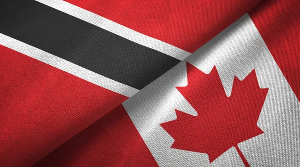 Trinidad und Tobago und Kanada zwei Flaggen Textilstoff, Textur — Stockfoto