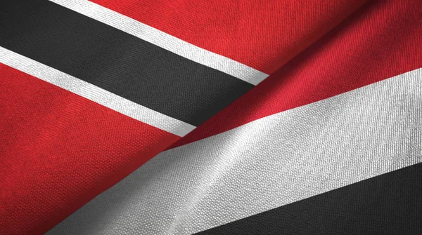 Trinidad e Tobago e Yemen due bandiere tessuto, tessitura del tessuto — Foto Stock