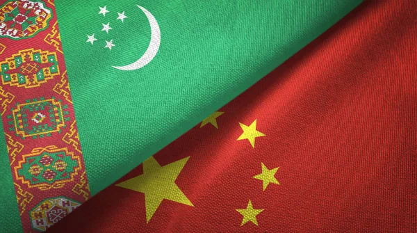 Turkmenistan and China two flags textile cloth, fabric texture — Stock Photo, Image