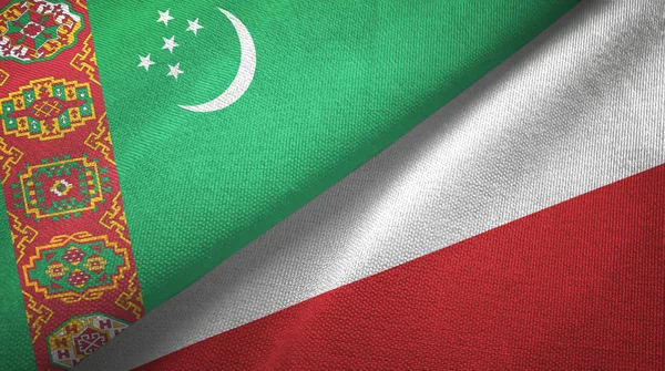 Turkmenistán y Polonia dos banderas tela textil, textura de la tela — Foto de Stock