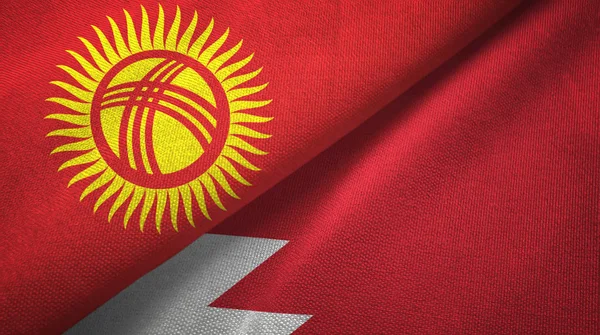 Kirguistán y Bahréin dos banderas tela textil, textura de la tela — Foto de Stock