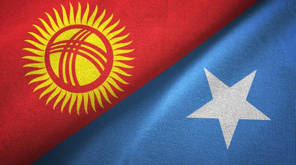 Kirguistán y Somalia dos banderas tela textil, textura de la tela — Foto de Stock