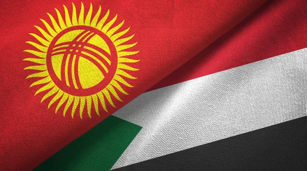 Kirguistán y Sudán dos banderas tela textil, textura de la tela — Foto de Stock