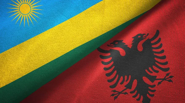 Rwanda and Albania two flags textile cloth, fabric texture