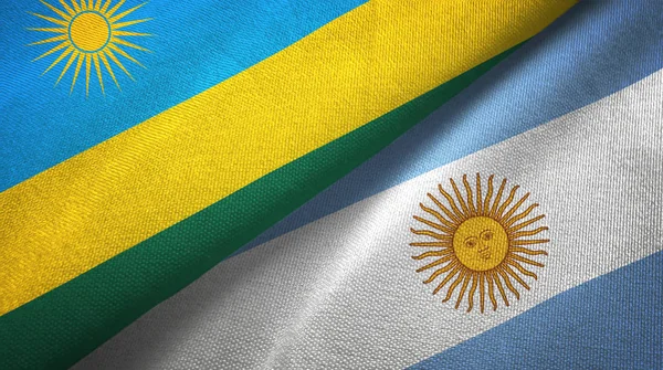 Rwanda och Argentina två flaggor textil trasa, tyg konsistens — Stockfoto