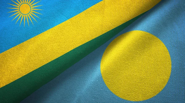 Ruanda ve Palau iki bayrak tekstil kumaş, kumaş doku — Stok fotoğraf