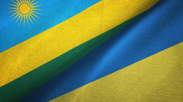 Η Ρουάντα και η Ουκρανία δύο σημαίες κλωστοϋφαντουργίας ύφασμα, υφή υφάσματος — Φωτογραφία Αρχείου