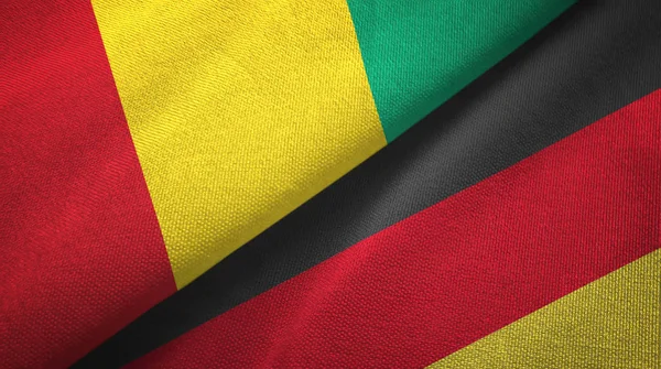 Guinea e Germania due bandiere tessuto, tessitura tessuto — Foto Stock