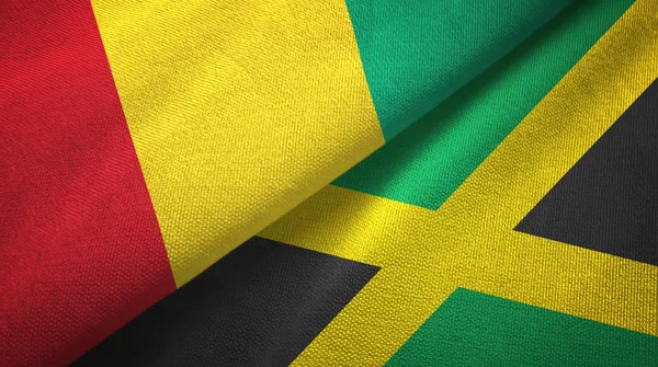 Guinea e Giamaica due bandiere tessuto, tessitura tessuto — Foto Stock