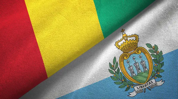 Guinea y San Marino dos banderas tela textil, textura de la tela — Foto de Stock