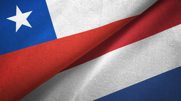 Chile y Países Bajos dos banderas tela textil, textura de tela —  Fotos de Stock